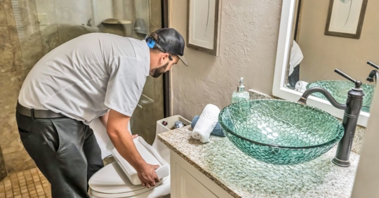 man working in toilet